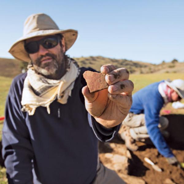 michael frachetti holds ceramic shard 