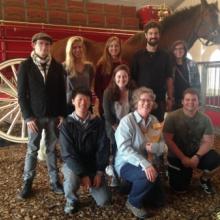 Fiona Marshall and eight students pose in front of a Clydesdale.